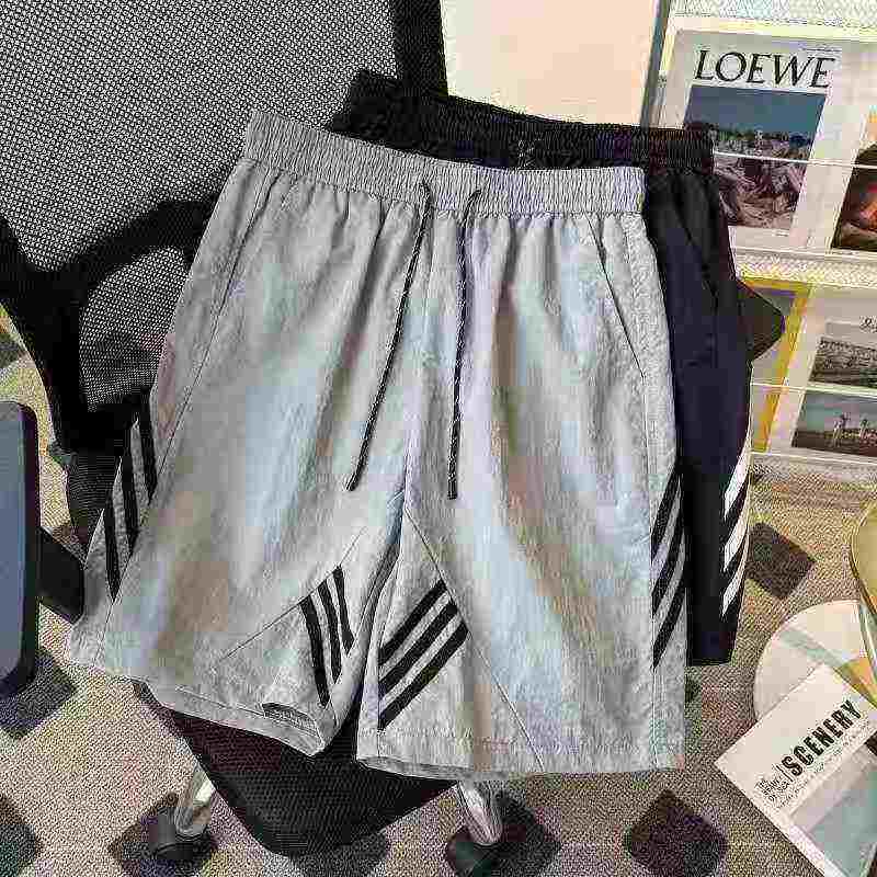 740 pièces Shorts de sport décontractés pour hommes de haute qualité, tendance américaine, en soie glacée à séchage rapide - Image 2