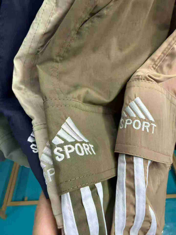 About 8880 Pieces Summer Cotton Loose Men's Embroidered Casual Workwear Cropped Pants - Image 1